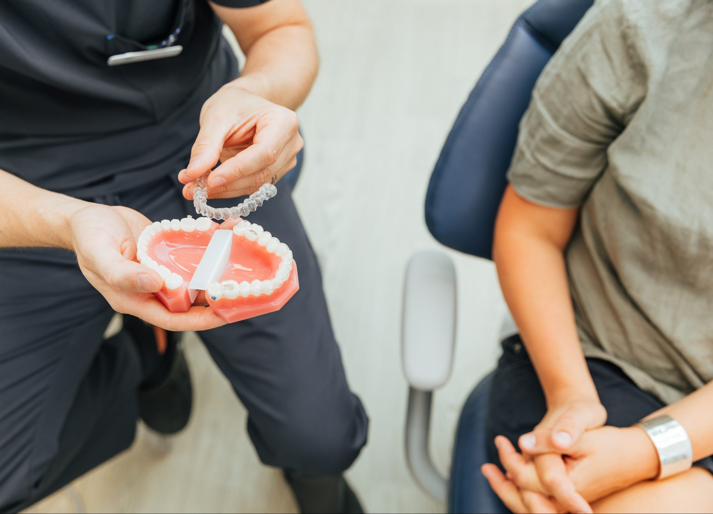 dentist holding a invisible aligner